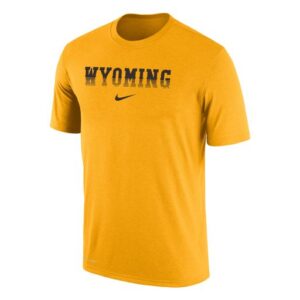 Gold Nike tee, design is black to gold fading word Wyoming above black Nike logo