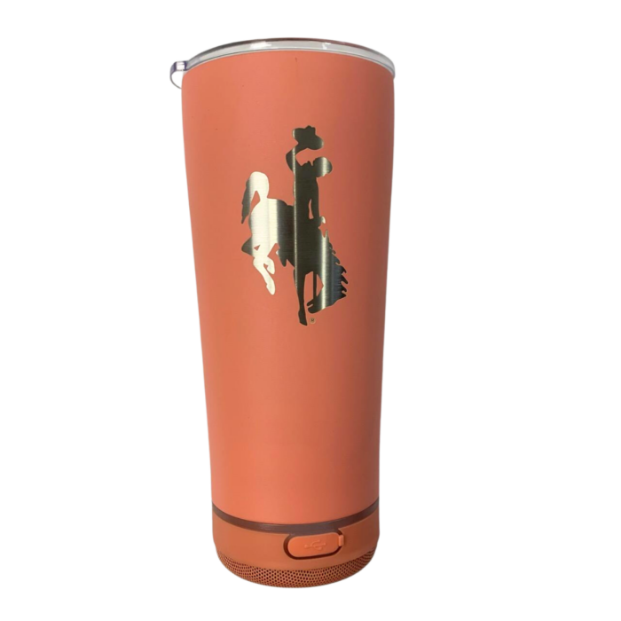 Coral tumbler with attached speaker bottom, design is silver bucking horse centered on front