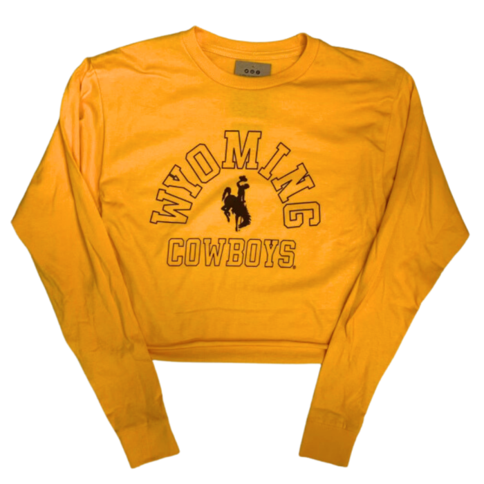 gold women's cropped long sleeved tee. Design is arced word Wyoming with bucking horse, then word Cowboys below. Text is in a brown outline font