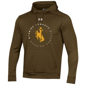 Brown hoodie, design is white under armour logo above white word Wyoming cowboys brown word Wyoming cowboys white outline circled around gold bucking horse