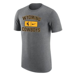 Dark grey tee, design is brown word Wyoming gold outline above gold stripe with brown bucking horse brown Nike logo, above brown word cowboys gold outline