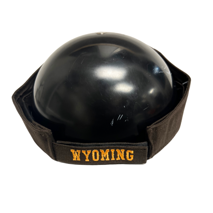 Back of brown adjustable visor, design is gold word Wyoming on velcro closure