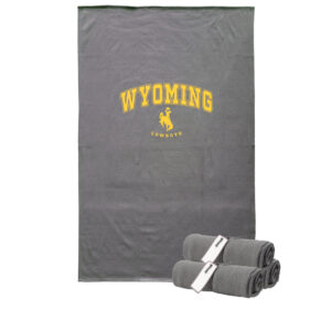 grey rectangle blanket with arced word Wyoming on center, bucking horse and smaller word cowboys below. Design in gold color.