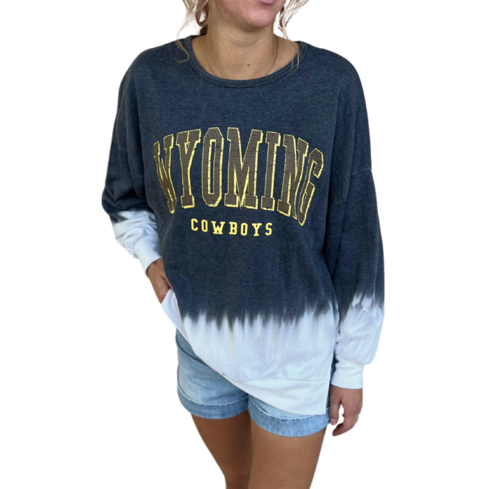 Grey and white pullover crewneck, design is brown word Wyoming gold outline above gold word cowboys, bottom half of crewneck is white