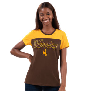 women's short sleeved tee. main body is brown, with shoulders and neckline gold. Word Wyoming printed on front in glitter outline font, gold bucking horse below
