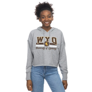 grey women's cropped hooded sweatshirt. Design on front is slogan WYO with brown and white stripe below, bucking horse in the center. Below is slogan University of Wyoming in script font