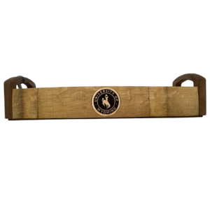Wooden barrel serving tray with handles, design is black seal gold outline with gold University of Wyoming surrounding gold bucking horse in center