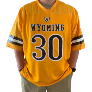 Gold replica football jersey, design is brown word Wyoming white ouline above large brown number 30 white outline, brown then white then brown stripe on each sleeve