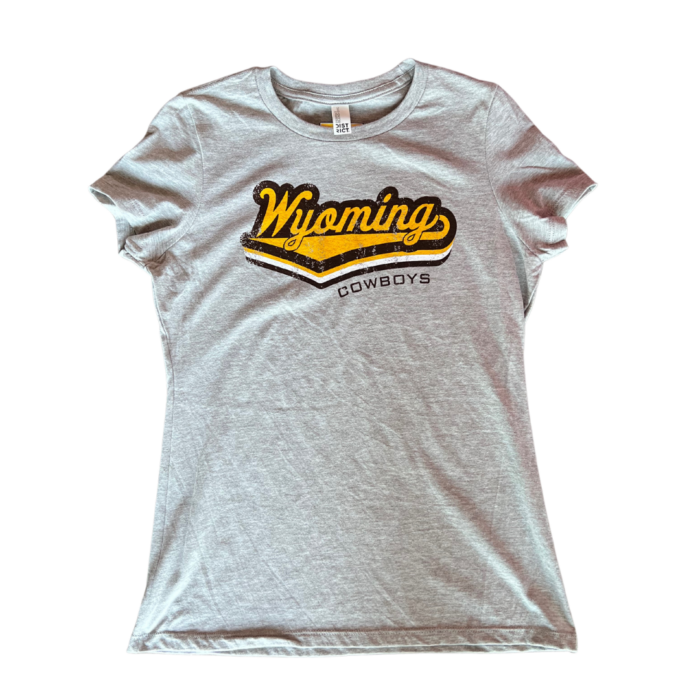 Grey women's tee, design is gold script word Wyoming brown outline with tail, brown word cowboys under Wyoming