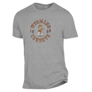 Grey tee, design is gold word Wyoming brown outline arched above brown 1886 and pistol pete logo, above arched gold word cowboys brown outline