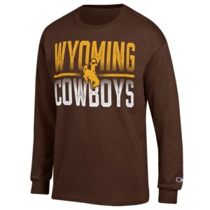 Brown long sleeve tee, design is gold word Wyoming above gold bucking horse, above white word cowboys