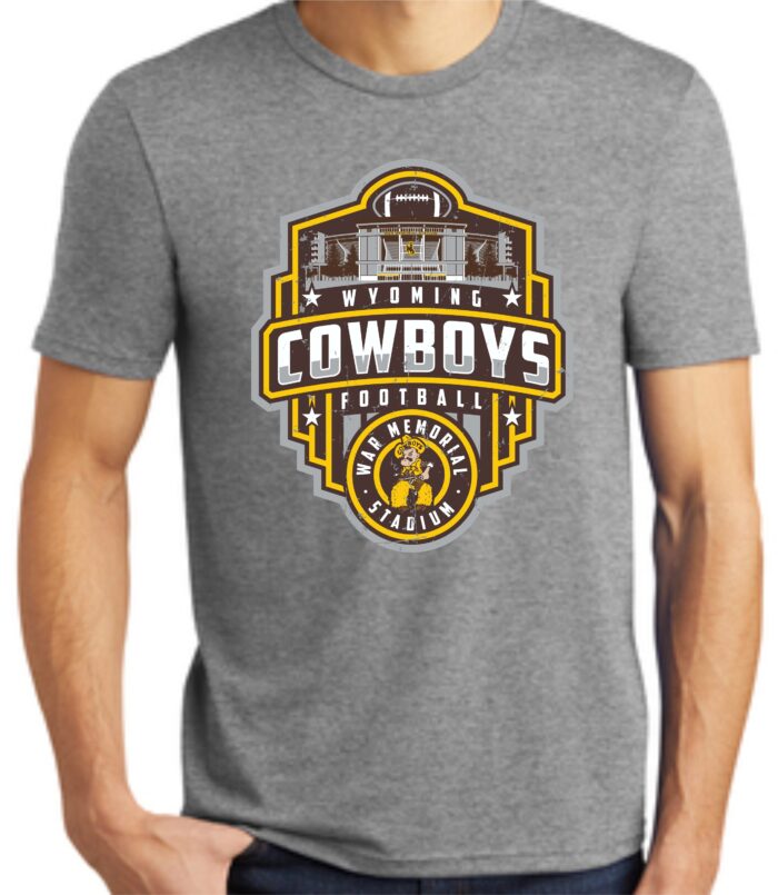 grey short sleeved tee. Design on front includes football field, slogan Wyoming Cowboys, and circle logo with Pistol Pete inside