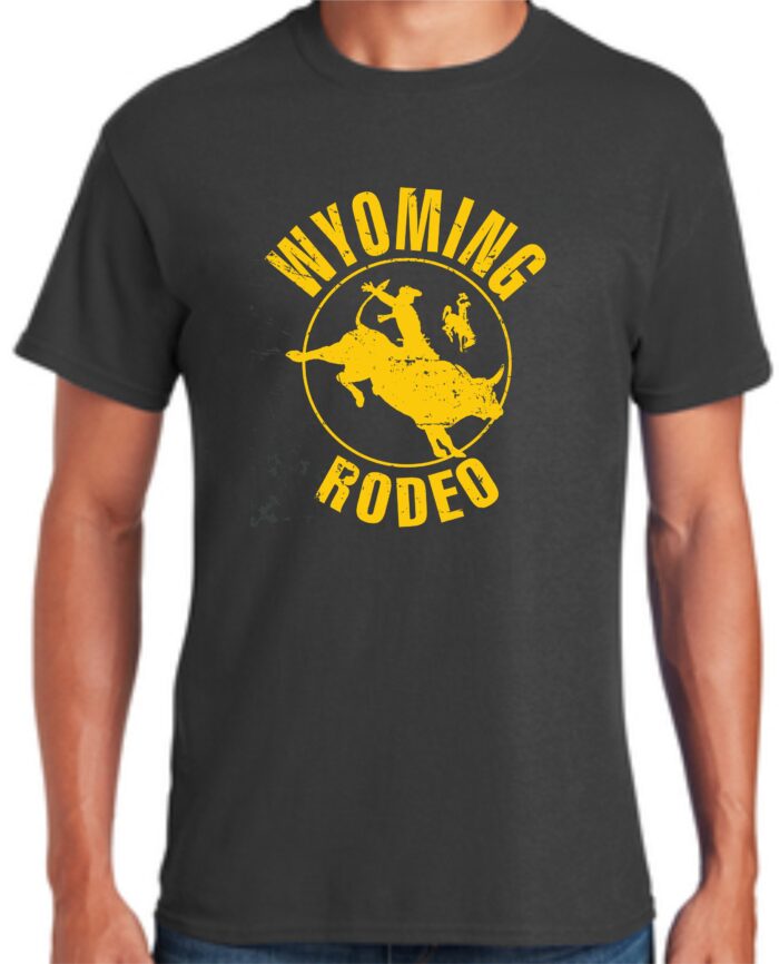 Grey tee, design is gold word Wyoming above gold rodeo logo with gold bucking horse inside, gold word rodeo below