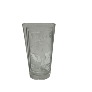 Etched pint glass, design is word Wyoming above bucking horse above word cowboys, words are surrounded by etched border