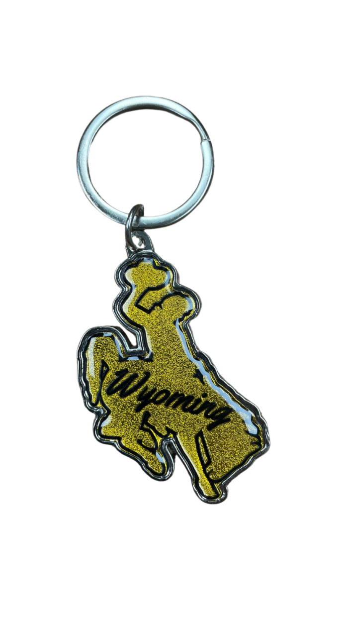 Bucking horse shaped keychain, design is gold metallic coloring with script brown word Wyoming