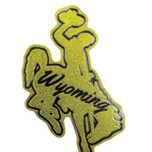 Bucking horse shaped magnet, design is gold metallic coloring with script brown word Wyoming