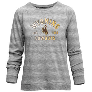 Women's grey long sleeve, design is gold word Wyoming arched above gold est. 1886 with brown bucking horse gold outline, gold word cowboys below