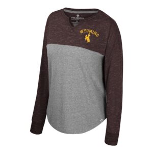 Women's grey long sleeve with brown sleeve and upper torso, design is gold word Wyoming above gold bucking horse on left chest