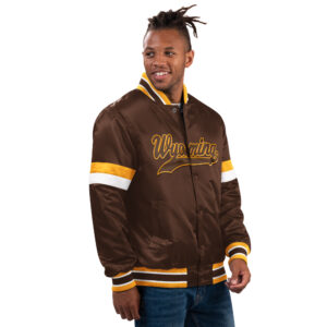Brown jacket with gold and white stripes on sleeves, design is brown word Wyoming with tail gold outline, brown gold and white stripes on neckline, cuffs, and hem line