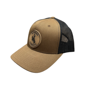Light brown hat with black mesh backing, design is brown leather circle with word Wyoming above bucking horse above word cowboys