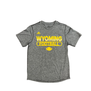 Adidas grey tee, design is gold Adidas logo above gold word Wyoming with white stripes on lower half, above gold word football, above gold football