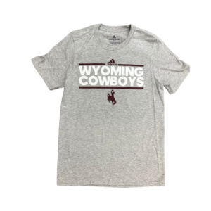 Adidas grey tee, design is brown Adidas logo with horizonal line above white word Wyoming above white word cowboys, above brown horizontal line and brown bucking horse