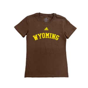 Women's brown Adidas tee, design is gold Adidas logo above gold word Wyoming