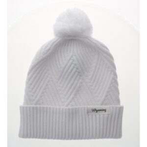 Women's white beanie, design is textured diamond pattern, cuff has white patch with brown word Wyoming