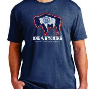 Navy short sleeve, design is navy buffalo with Wyoming state flag design, above white word one Wyoming with whit bucking horse