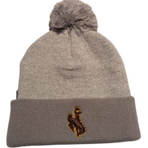 Grey Beanie with cuff on bottom and pom on top. On cuff, brown bucking horse with yellow outline.