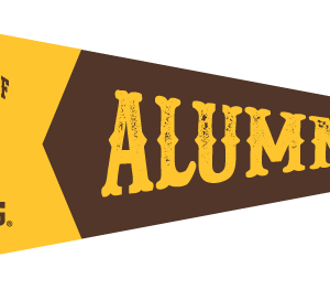 color block 12x32 banner. at wide end, gold background with arced university of wyoming with bucking horse in brown. At tapered end, brown background with block Alumni in gold.