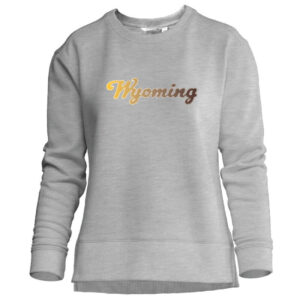grey women's crewneck sweatshirt. design on front is script Wyoming with Ombre from right to left, right is gold left is brown.