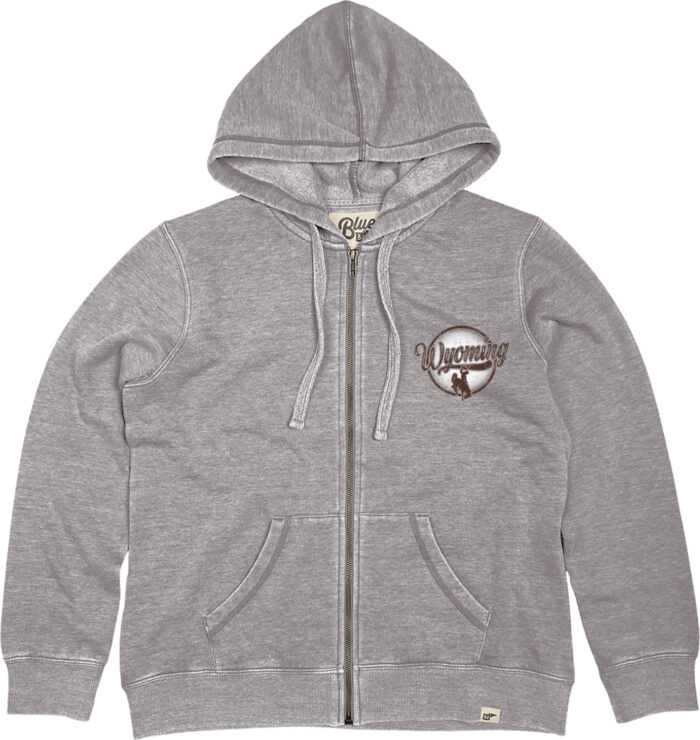 grey full zip hooded sweatshirt. Design on front left chest. Script wyoming and bucking horse within a circle. Text is brown background of circle is white.