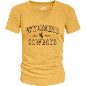 womens v-neck t-shirt in gold. On front, in all brown text, arced wyoming with bucking horse under and cowboys at bottom. Design is centered.