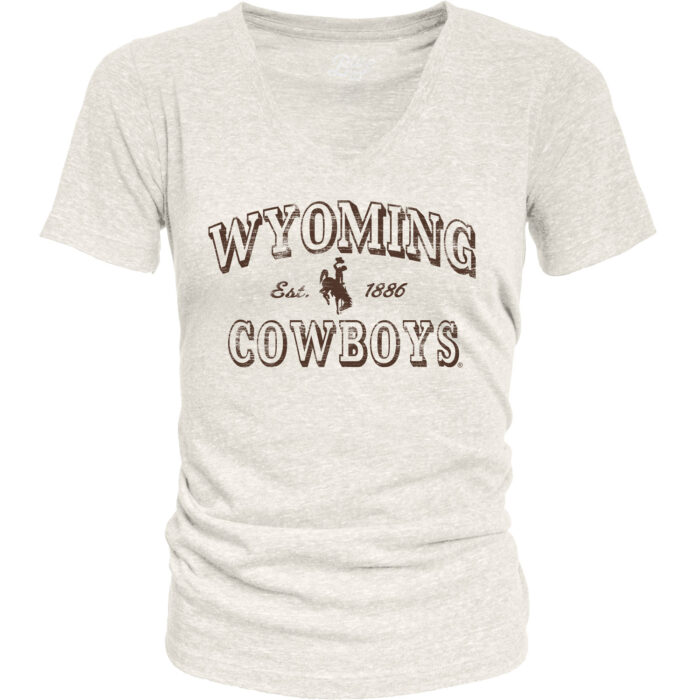 womens v-neck t-shirt in off white. On front in all brown text, arced wyoming with bucking horse under and cowboys at bottom. Design is centered.