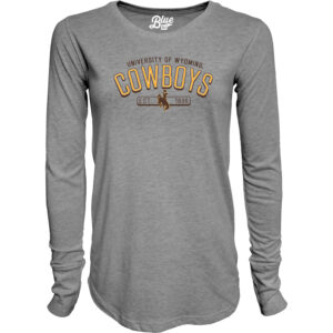 grey long sleeve t-shirt. Design in center chest, university of wyoming in brown arced at top with gold cowboys under. Brown bucking horse and est. 1886 under cowboys.