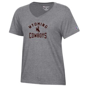 Grey womens short sleeve tee. design is arced wyoming with bucking horse under and cowboys at bottom. Design is in center chest in all brown