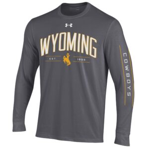 grey long sleeve t-shirt with design on front and left sleeve. arced wyoming in white with gold outline. bucking horse under wyo. Cowboys in white with gold bars on sleeve