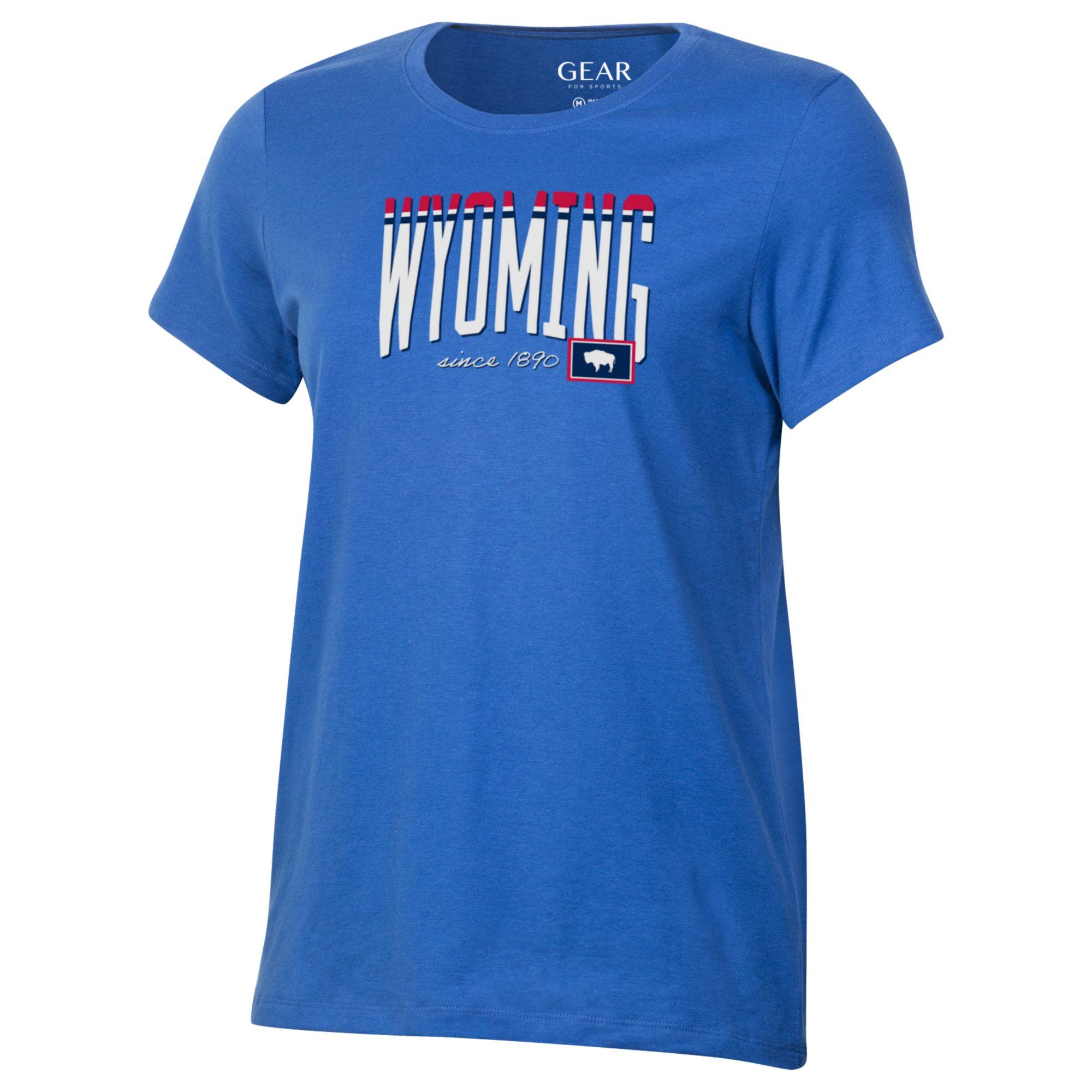 Blue womens short sleeve t-shirt. Wyoming on center chest in white, red and blue, with state flag in lower left corner. Design is center chest.