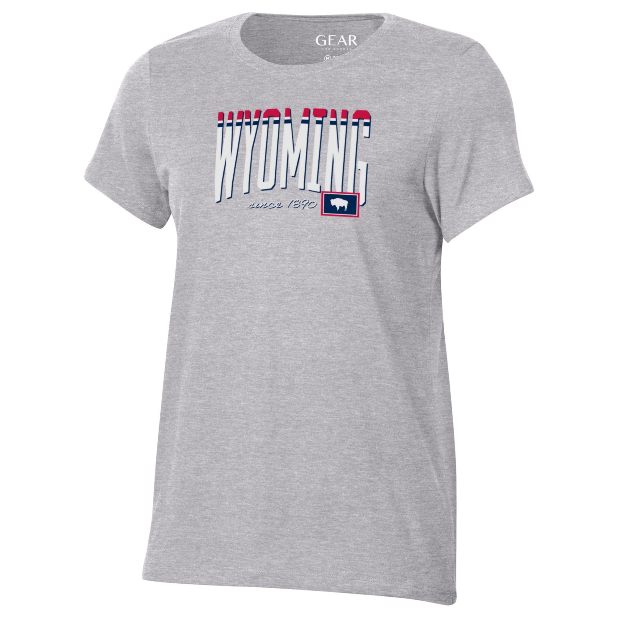 Grey womens short sleeve t-shirt. Wyoming on center chest in white, red and blue, with state flag in lower left corner. Design is center chest.