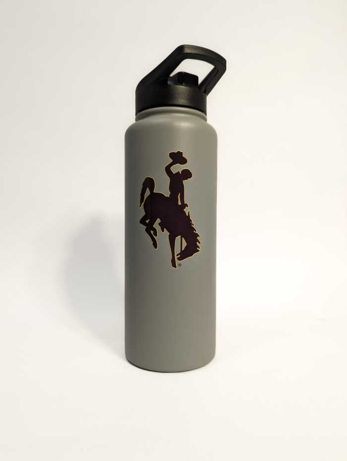 grey 34-ounce water bottle with brown bucking horse on one side. bucking horse has gold outline