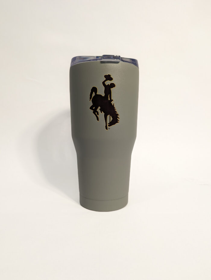 grey 30-ounce tumbler with brown bucking horse with gold outline and wyoming in brown with gold outline.