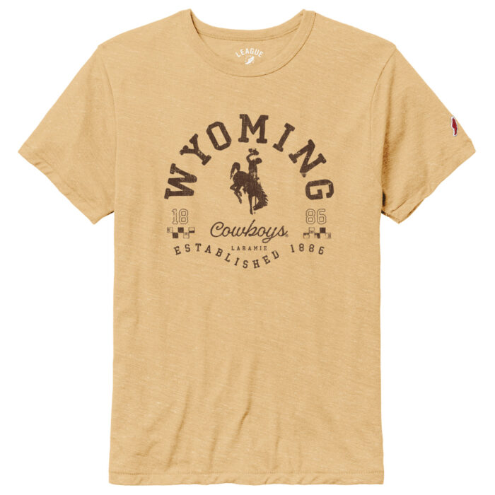 gold short sleeve t-shirt, with brown design on front. Wyoming in half circle shape with bucking horse under. Script cowboys under bucking horse with established 1886 under. Design is center chest