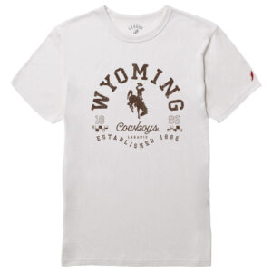 white short sleeve t-shirt, with brown design on front. Wyoming in half circle shape with bucking horse under. Script cowboys under bucking horse with established 1886 under. Design is center chest