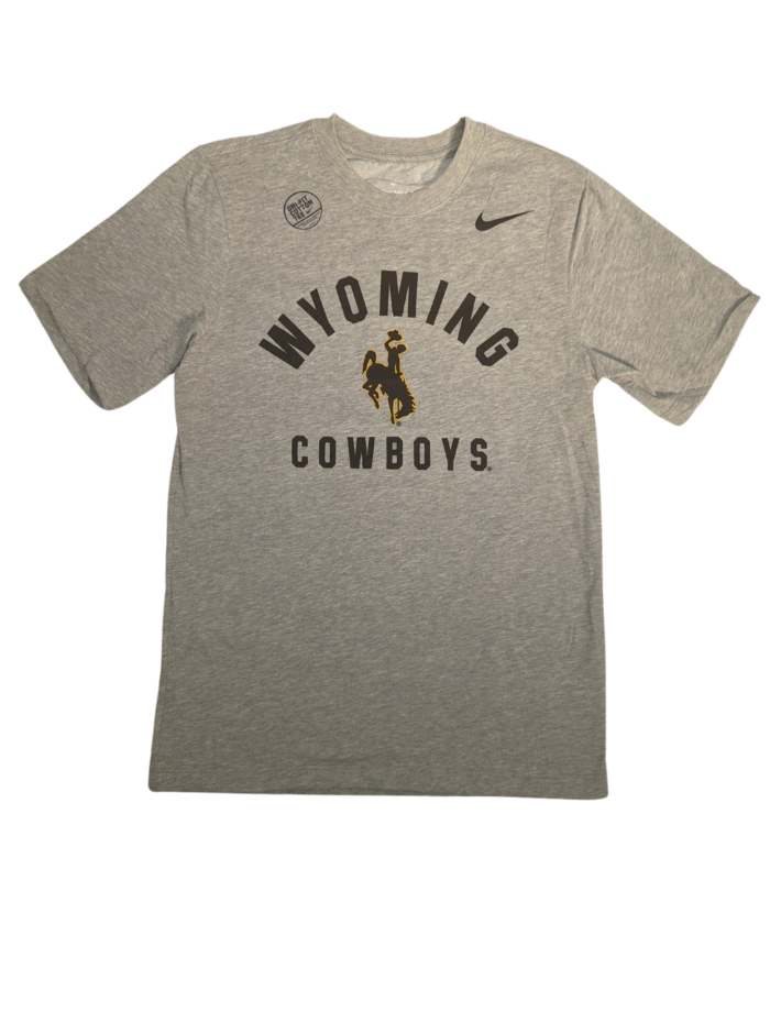 grey short sleeve tee with design on front, arced wyoming with bucking horse under and cowboys at bottom. Design, center chest and all brown