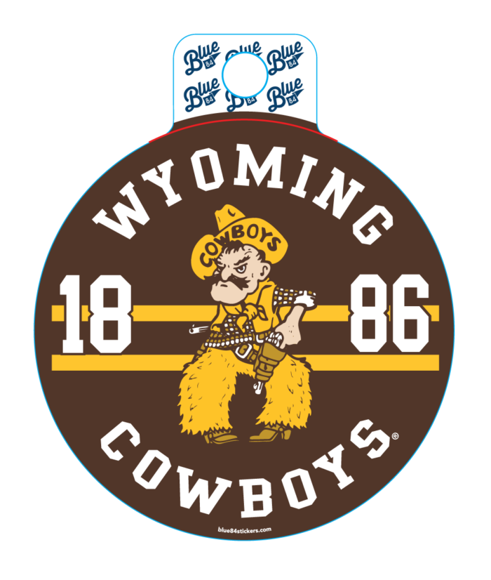 circle decal with brown background, arced wyoming and cowboys at top and bottom in white. 1886 with pistol pete in center