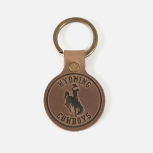 Brown leather key chain with heat stamp of wyoming cowboys and bucking horse.