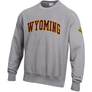 Grey crewneck sweatshirt with embroidered arced wyoming in brown with gold outline. Brown bucking horse with gold outline on left sleeve.