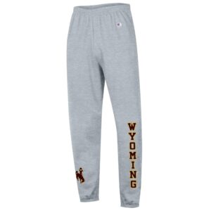 grey sweatpants with wyoming down left leg, below knee, in brown with gold outline. Brown bucking horse on right ankle