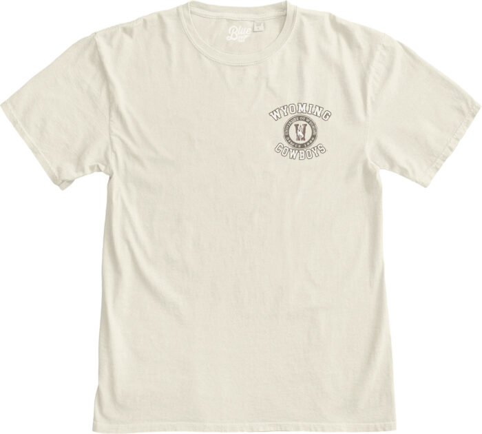 front of ivory short sleeve tee with design in white with brown outline on left chest and back wyoming at top with circle under. in circle is W with bucking horse. under circle, cowboys